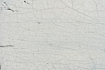 Old wooden wall with cracked and peeling white paint - obrazy, fototapety, plakaty