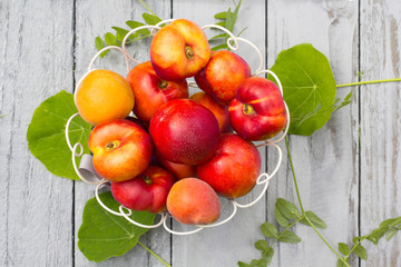 Stone Autumn fruit on the wooden table, flat view.