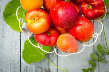 Stone Autumn fruit on the wooden table, flat view.