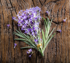 Bunch of lavandula or lavender flowers on the old wooden table.