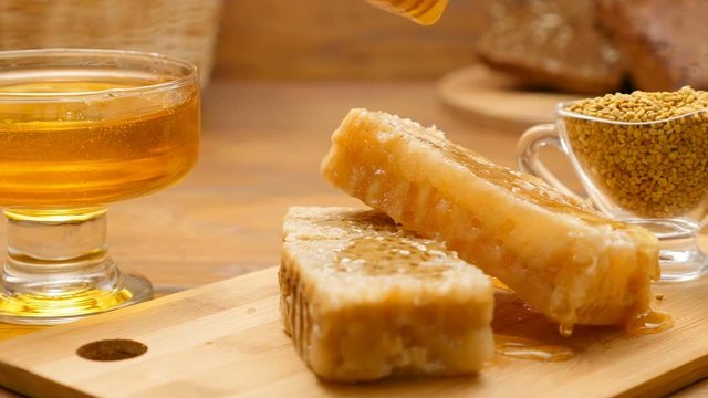 Composition of honey, honeycomb and bee bread. Honey pouring (No 5, LR Pan)