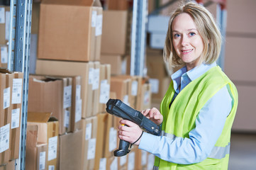 Warehouse Management System. Worker with barcode scanner
