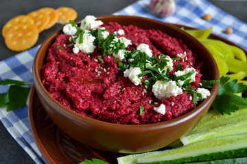 Appetizer of chickpeas - hummus with beetroot, vegetables and fe