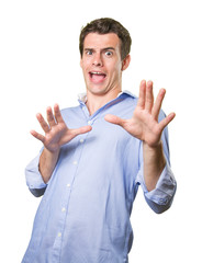 Young man screamingon white background