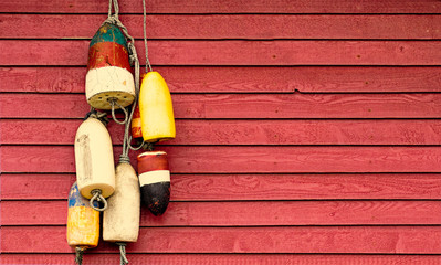 Vintage lobster floats on old red wood siding background. Nautical  © Crin