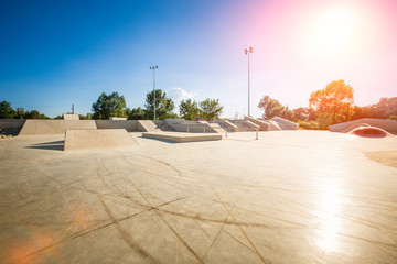Skate Park in the daytime. Urban design concrete skatepark. - obrazy, fototapety, plakaty
