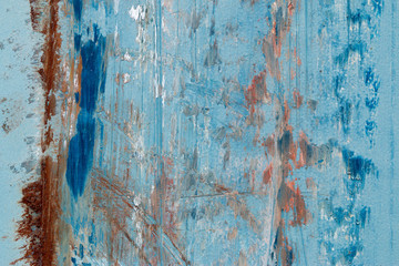 A background of peeling paint and rusty old metal