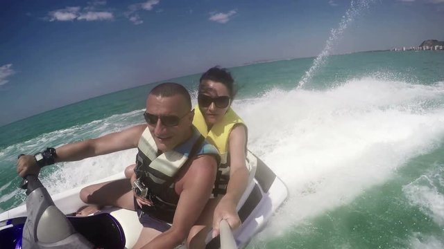 Couple riding on a jet ski