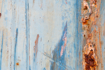 A background of peeling paint and rusty old metal