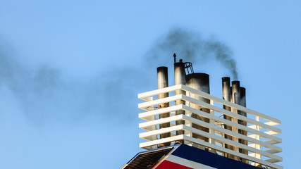Vessel chimneys releasing smoke.