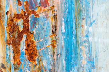 A background of peeling paint and rusty old metal