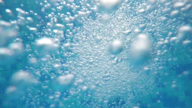 underwater bubbles from thermal spring pool SLOW MOTION