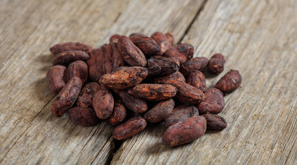 Cocoa beans on a wooden surface