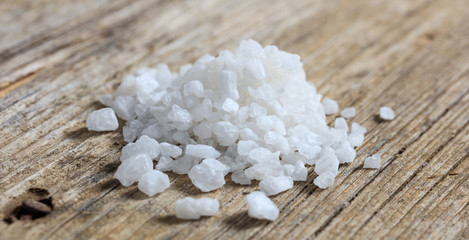 White salt on a wooden table