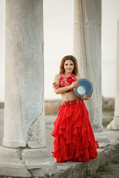 Bellydancer little girl dancing outdoors