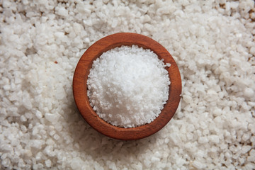 White salt in a wooden bowl