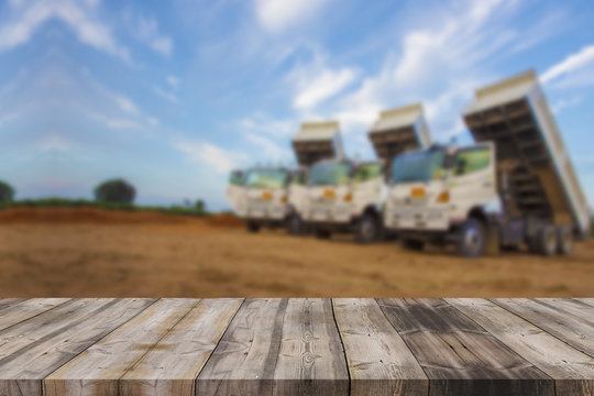 wood table top on blur background of construction site on vintag