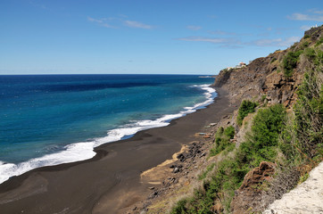 Boats under cliff