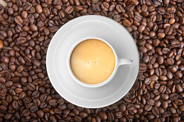 Cup of coffee on coffee beans background. 3d illustration