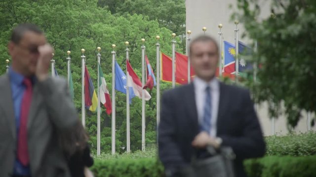 People walk in front of United Nations building in New York