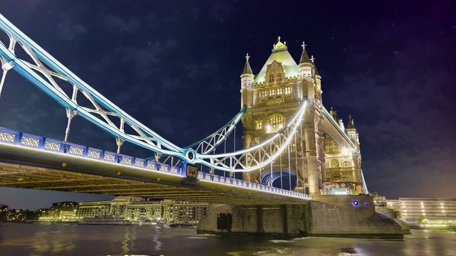 Tower bridge London timelapse at night with startrails and moving clouds, 