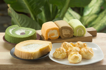 Flavors jam roll cake and Eclair