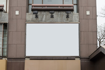 Large blank billboard on a street wall, banners with room to add your own text