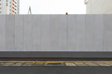 Large blank billboard on a street wall, banners with room to add your own text