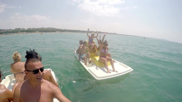 People having summer fun at pedal boat ride