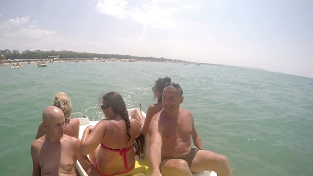 People having summer fun at pedal boat ride. 