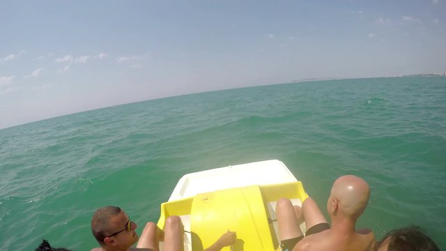 People having summer fun at pedal boat ride, 