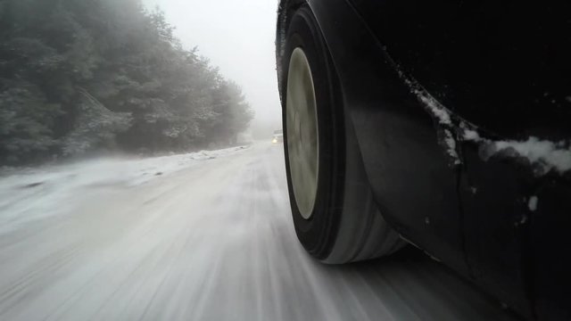 Car chase on snow mountain road,  