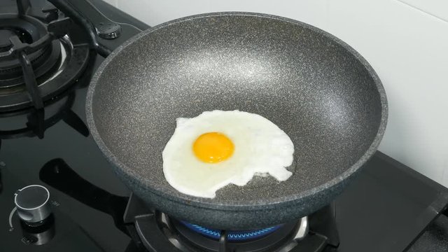 4k of Cooking eggs on a gas stove
