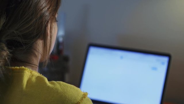 Young beautiful hispanic woman with headache while working with laptop pc at home, girl massaging forehead and studying late at night, female college student doing education homework for school