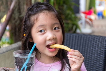 Child Eating French Fries
