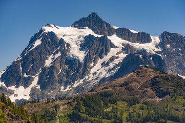 Fototapeta na wymiar Mt. Shuksan, Washington. Mount Shuksan may be one of the most photographed mountains in the Cascade Range seen here on the Chain Lakes Loop Trail. Mt. Baker National Forest.