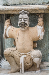 Chinese  Stone  doll in Wat Pho Bangkok Thailand.