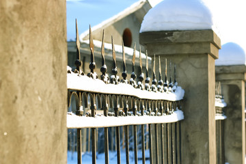 Naklejka premium fence covered snow winter park