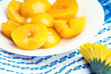Peaches on the dish and flower