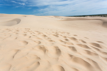 footprint on white sand dune desert in Mui Ne, Vietnam