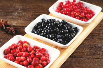 Berry fruits in a dishes 