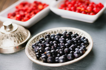 Berry fruits in bowl and dishes