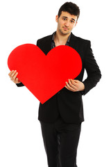 Young businessman holding red heart