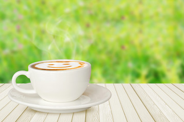  smile coffee on white wood table on green nature
