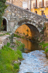 Fototapeta na wymiar Arch stone bridge and pedestrian in the city of Cuenca, Spain