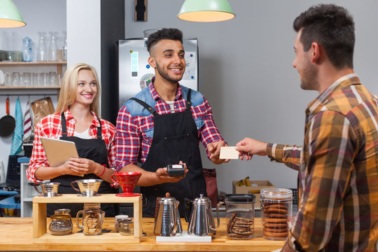 Barista Serving Client Give Card Paying Bill At Coffee Shop Bar Counter