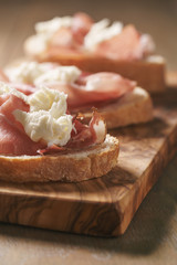 simple ciabatta slices with speck and mozzarella