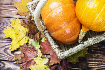 Obraz na płótnie Canvas pumpkins for Halloween in a basket 