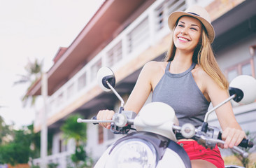 Fototapeta na wymiar Riding lifestyle. Outdoor portrait of pretty young woman in hat