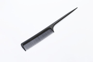 Black plastic comb on white background